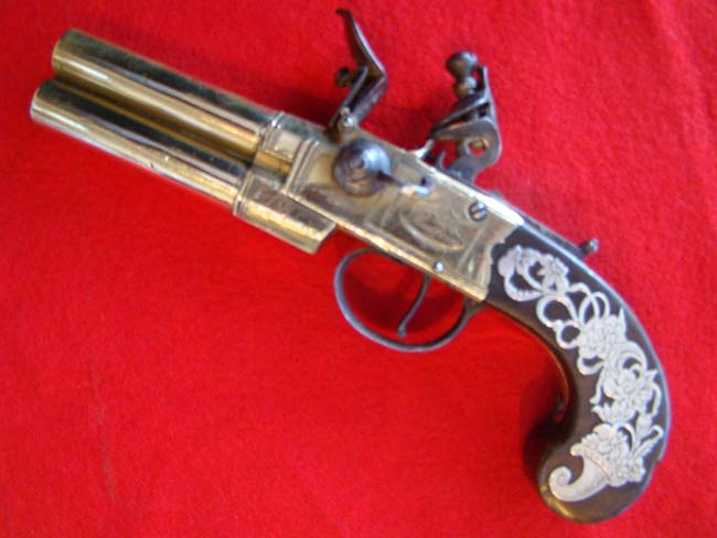 A fine late 18th century English tap action over/under brass barreled flintlock pistol — image 2
